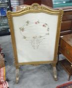Giltwood firescreen with shell, floral and scroll pediment, inset with silk embroidered floral