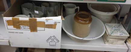 A quantity of white ceramic jugs, a large oversized glass vase labelled 