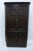 Late Georgian pine floor-standing corner cupboard with greek key cornice, the upper section with two