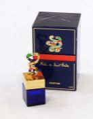 Niki De Saint Phalle (1932-2002) 1st edition painted resin, gilt and blue glass perfume bottle, with