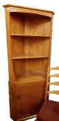Light elm Ercol corner display cabinet with three open shelves above cupboard door, 179cm high