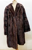 Two vintage fur coats, one being goatskin trimmed with mink, two faux-fur coats, a faux-fur shrug, a