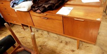 Austinsuite teak sideboard with central drawer and drop down cocktail cabinet, flanked by pair