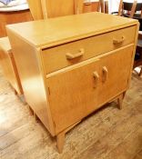 20th century light oak G-Plan cupboard with single drawer above two cupboard doors, on tapering