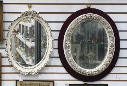 Continental porcelain white oval flower encrusted mirror, circa 1900, encrusted with continuous band