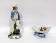 Two Lladro figures, printed blue marks, comprising: a lady sailor modelled seated holding a