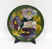 Moorcroft pottery 'Hibiscus' pattern green ground plate, impressed Moorcroft, made in England and
