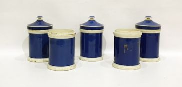Five Staffordshire pottery blue ground storage jars and three covers, variously inscribed in gilt