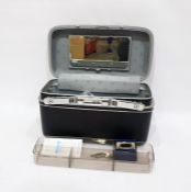 Camera tripod and a Kodalux 3 electronic flash in a Samsonite hinged case with combination lock