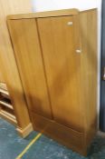 20th century oak wardrobe, the two doors above a single drawer, raised on plinth base 91 x 175cm