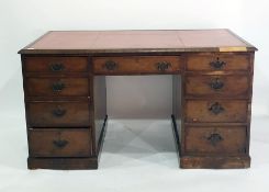 Pedestal desk with inset red leatherette top, doors to plinth base