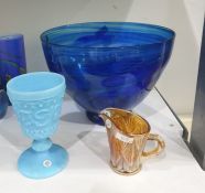 Blue tinted press-moulded glass goblet, 14cm high and a modern glass footed bowl of blue tint,
