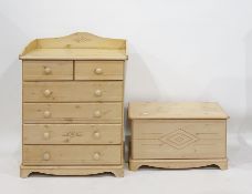 Limed pine-effect baby changing unit with three-quarter gallery top over two short and four long