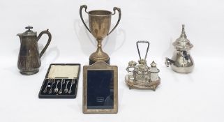 Quantity of silver plate to include a two-handled trophy, a cistern and cover and burner, a large
