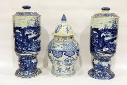 Pair of modern porcelain Chinese-style blue and white cylindrical sectional vases and covers,