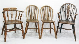 Elm seated captain's chair with turned front legs, stretchered base, three further elm seated chairs