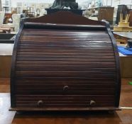 Mahogany tambour fronted desk tidy, three quarter galleried top above the tambour front enclosing