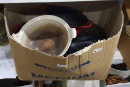 Box of cookware in the style of Le Crueset
