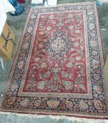 Kashan rug, red ground with stepped central medallion on a foliate decorated field , stepped