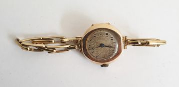 Old 9ct gold lady's wristwatch, by Texina, with spring loaded expanding braceletCondition Reportno