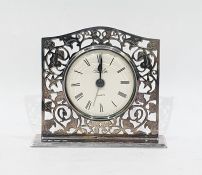 Silver-framed alarm clock with quartz movement, foliate open fretwork design, Birmingham 1996