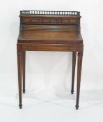 20th century mahogany bureau with three-quarter back galleried brass top, above three short drawers,