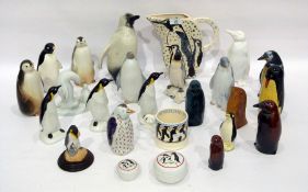 20th century group of porcelain, pottery, glass and wood models of penguins, the tallest 22.2cm