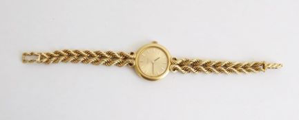 Lady's 18ct gold Omega dress watch with gold-coloured dial, baton markers, with a ropetwist bracelet