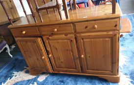 20th century pine sideboard with three drawers above three cupboard doors, to bracket feet