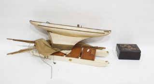 Wooden model of a sailing boat, 53.2cm long,  a group of lacquer boxes in sizes, gilt with scrolling