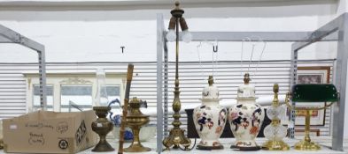 Seven various table lamps to include two in the Chinese ginger jar style and two brass oil lamps and
