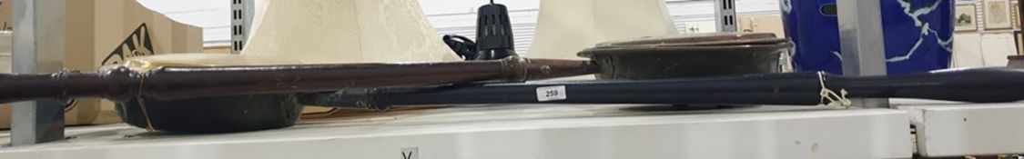 Two brass, copper and wooden bed warmers (2)