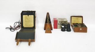 Avometer, model no.40, cased, a Megger circuit testing ohmmeter, cased, a metronome by Maelzel,