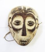 A Congolese South Kivu Lega tribe mask of male form, 20cm tall