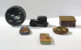 A quantity of tea and biscuit tins, to include a vintage black car shaped tin, two tin money