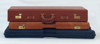 Giubileo hide covered gun case made in Italy, a Browning gun case and another Italian plastic gun