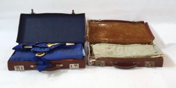 Two suitcases containing Masonic regalia, including aprons, one named for Surrey, medals, sashes,