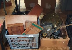 Box of metalware and a box of treen to include miniature pierced black back rocking chair, pair of