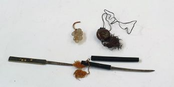 Two Japanese knives, a carved onyx figure and a red stone, engraved and enriched in green with