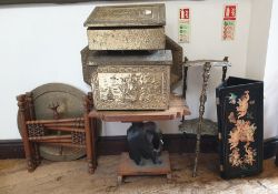 A collection of brassware and a carved wooden table, a two tiered brass jardiniere stand, cast