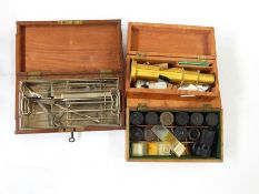 A brass minocular microscope in box, set of scalpels in removable tray in brass and mahogany box and