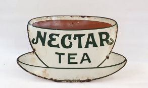 A metal enamelled nectar tea advertising sign, in the form of a teacup and saucer, in white and