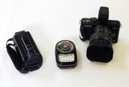 Lumix Panasonic DMC-GX1 camera, a Canon Legria HFR606 hand-held video camera and a Weston Master III