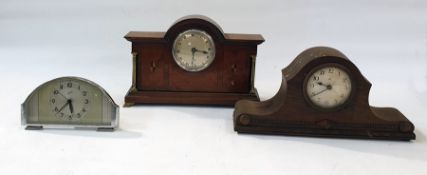 A comet 8 day alarm clock, two mantle clocks and two wooden mounted mantle clocks, one an Elliott