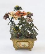 A Chinese jade stone, quartz, mother of pearl, mounted flowering tree in a brass rectangular section