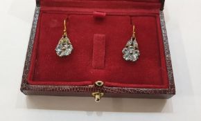Pair of yellow gold-coloured metal, topaz and diamond earrings, each flowerhead set with five