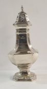 George V silver sugar caster of octagonal baluster form, stepped foot and domed octagonal pierced