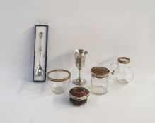 Silver and tortoiseshell brush and capped dressing table bottle, a silver presentation cup of bell