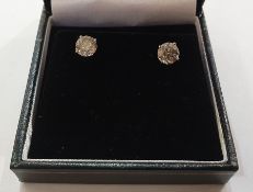 Pair 18ct white gold and diamond stud earrings, each circular claw set, 3.07ct total approx