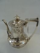 Silver coffee pot, with floral engraving, gadrooned border of semi-waisted form, to raised